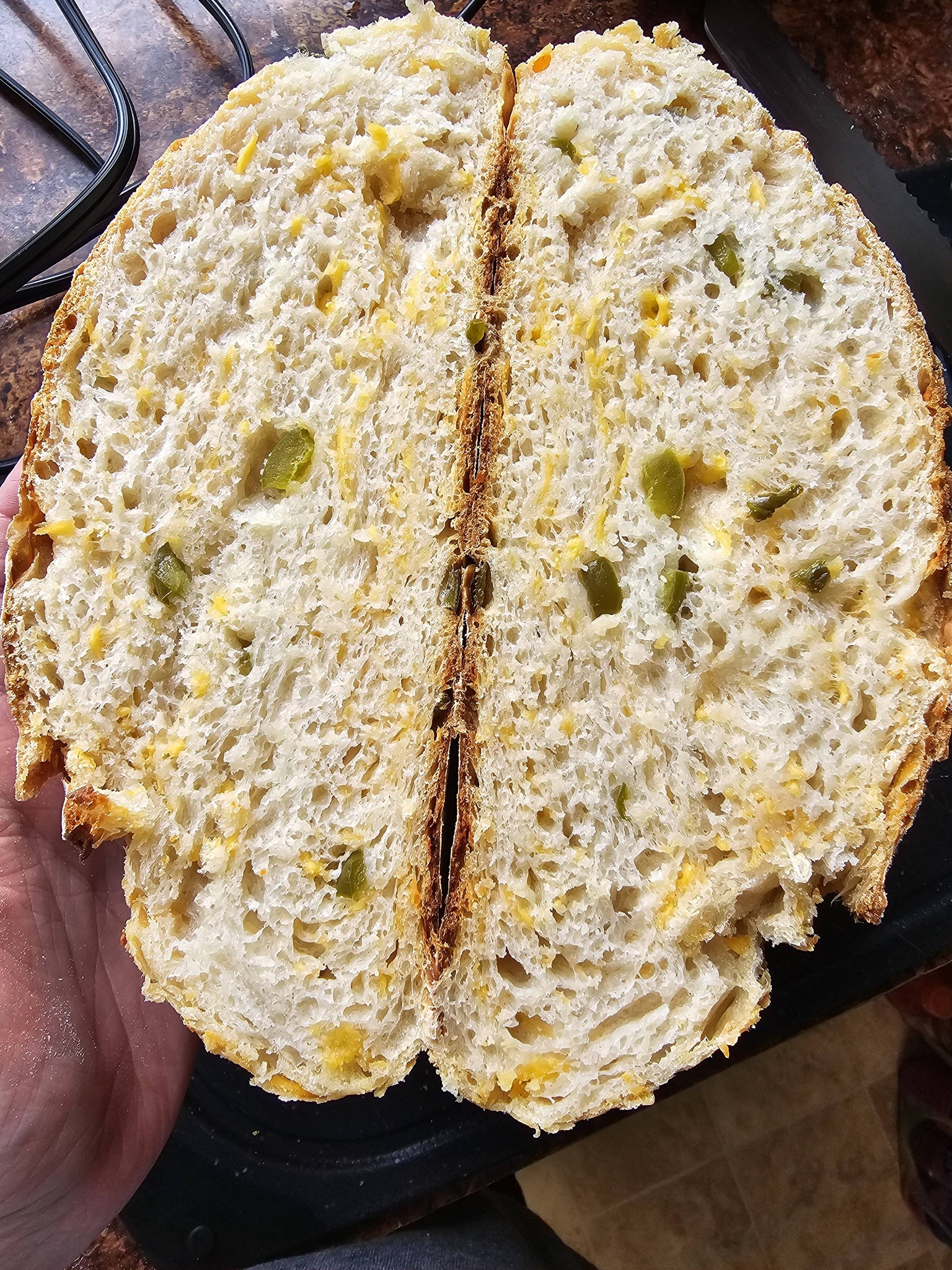 Gallery image of a sourdough loaf with cheddar and Jalapeno inclusions
